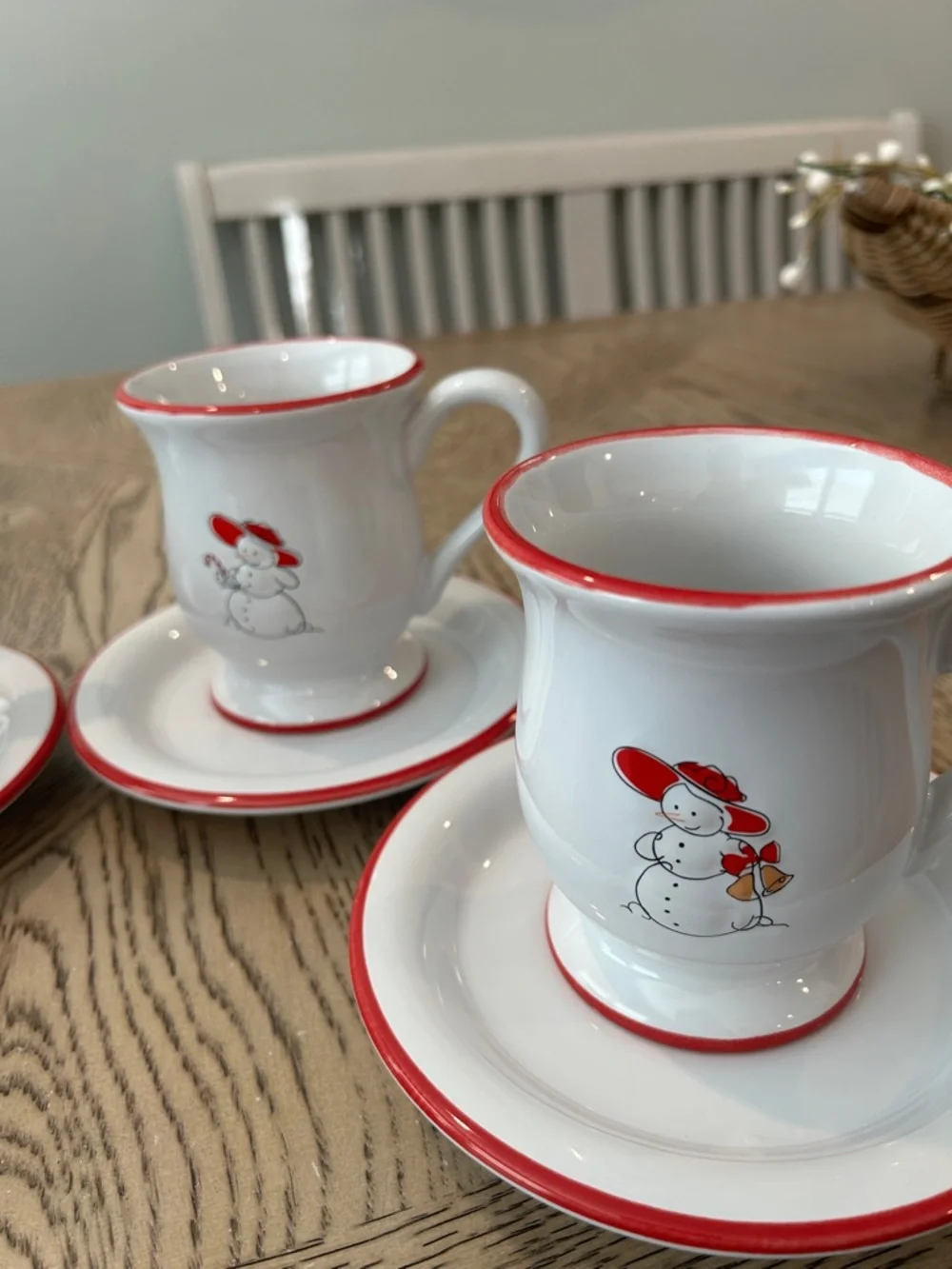 Williams Sonoma White Mugs and dessert plates with Red-Rim Snowman Motif